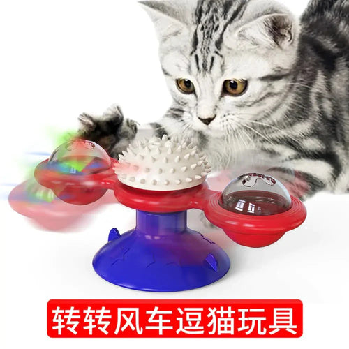 Cat playing with a colorful Twirling Cat Fun Toy with spinning lights and textured surfaces on a blue suction base