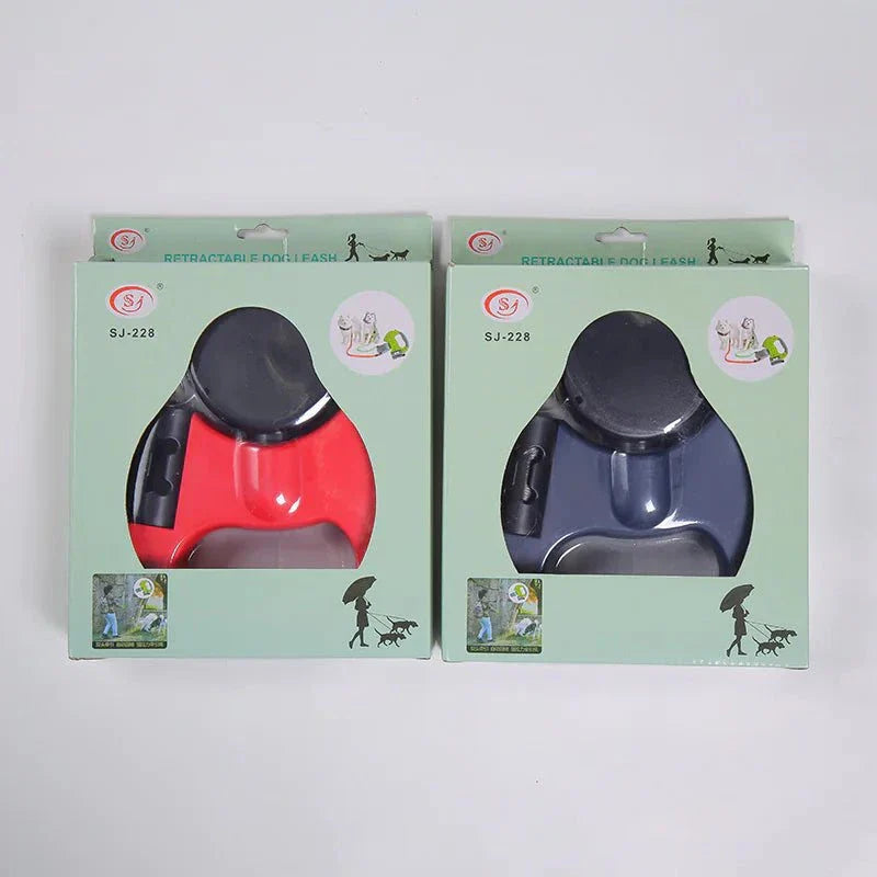 Dual dog retractable leash with ergonomic handle in red and blue packaging for walking two dogs simultaneously