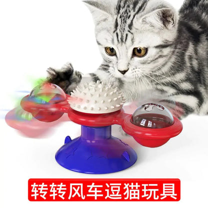Cat playing with a colorful Twirling Cat Fun Toy with spinning lights and textured surfaces on a blue suction base