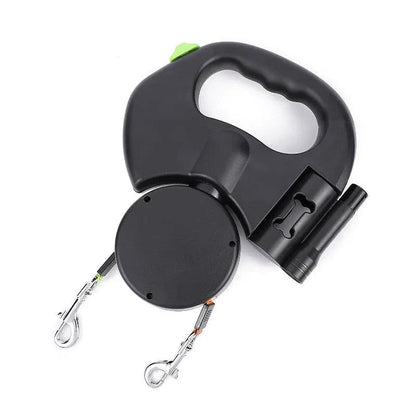 Black dual dog retractable leash with ergonomic handle, dual independent controls, built-in LED flashlight, and poop bag dispenser for walking two dogs without tangles